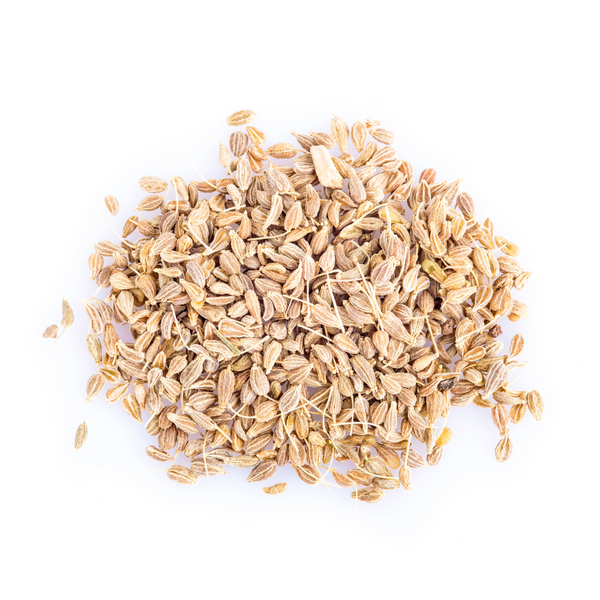 Granos de anís natural sobre fondo rústico – semilla aromática con propiedades digestivas y usos en cocina y medicina tradicional